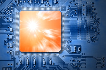 powerful, fast orange cpu / processor on blue circuit board