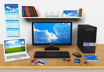 Office workplace with desktop computer, laptop and other devices