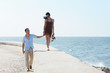 © Diego Cervo - young husband and wife during afternoon walk near the sea