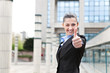 © luckybusiness - businesswoman winking and giving thumbs up