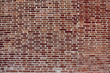 background of convex dark red brick wall