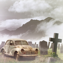 A Misty Graveyard, With Tombstones And An Old Car