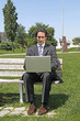 © policas - Happy successful businessman sitting, working on laptop compute