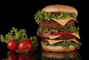 Wall Mural - delicious hamburger on black background