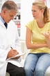 © Monkey Business - Doctor with female patient