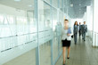 © pressmaster - Businesspeople in corridor