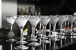 Classical martini in chilled glass over black background on