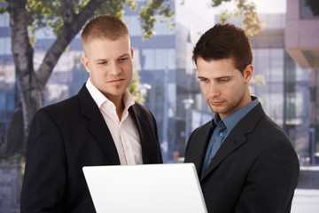 Sticker - Two businessmen with laptop outside of office