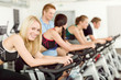 © CandyBox Images - Young fitness people bike spinning with instructor