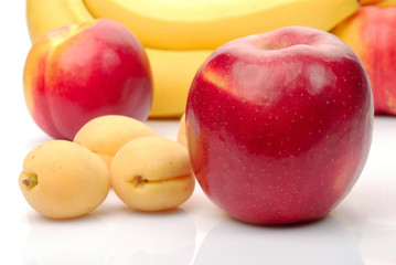 red and yellow fresh fruits isolated on white