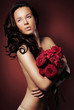 Beautiful young lady with roses bouquet