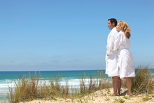 Couple In Robes On The Beach