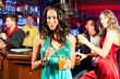 © Kzenon - People with cocktails in bar or club