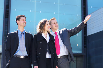 Three young brunette business persons in formal clothes