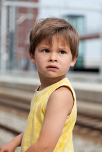 Portrait Of Young Boy At Train Station
