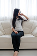 © taka - beautiful asian woman relaxing on the couch