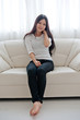© taka - beautiful asian woman relaxing on the couch