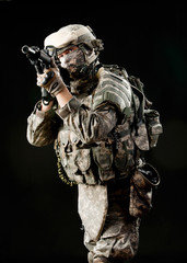  Soldier with a rifle on a black background