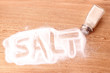 © Africa Studio - salt in the salt shaker on wooden background