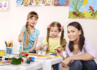 Wall Mural - Child painting in preschool.