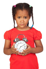 Sad little girl with a silvered clock