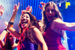 © Kzenon - Party people dancing in disco or club
