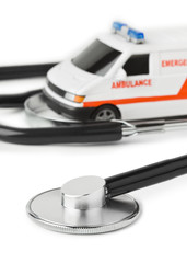 Wall Mural - Stethoscope and toy ambulance car