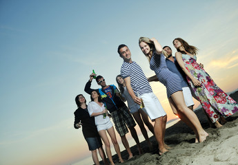 Poster - Group of young people enjoy summer  party at the beach