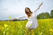 © bartekwardziak - brunette woman in a yellow flowers field