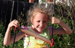 joyful girl playing in the yard