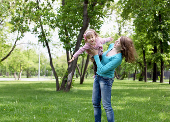 Wall Mural - Portrait of mother with daughter outdoor