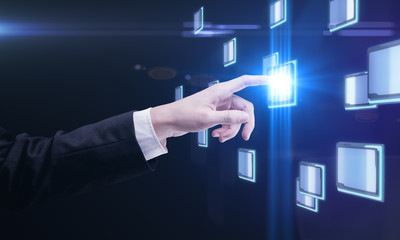 hand pushing a button on a touch screen interface