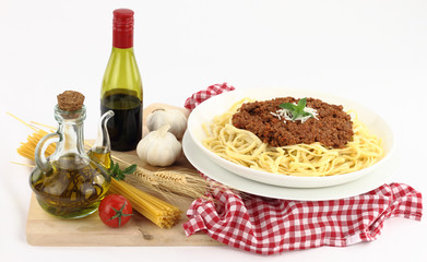 Bolognese pasta with ingredients isolated on white