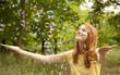 © Masson - Redhead girl in the park under soap bubble rain.