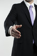 © NB - businessman extending hand for a handshake