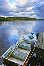 Rowboat Docked On Lake
