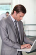 © auremar - Young businessman using laptop computer