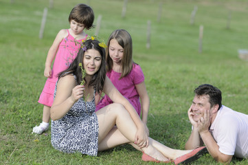 Wall Mural - beautiful family relaxing in summer season