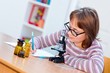 © Szasz-Fabian Erika - Teen science girl with microscope