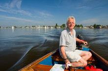 Elderly Man In Boat