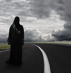 Muslim woman walking alone searching for the right path