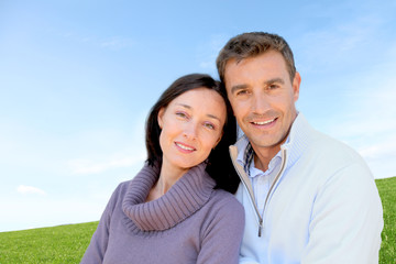 Wall Mural - Portrait of couple standing outside