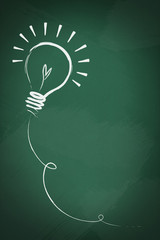 Drawing of a bulb idea on green board