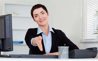 Poster - Charming business woman giving her hand