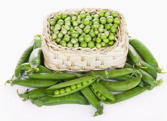 Poster - wood basket with green peas the isolated