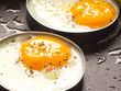 close up of fried eggs on a pan