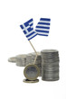 Euro-Münzen mit zerrissener Griechenland-Flagge