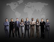 © ASDF - Businessmen standing in front of an earth map