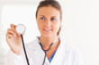 © WavebreakmediaMicro - gorgeous brunette doctor showing stethoscope to the camera