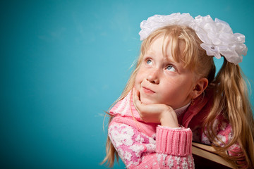 Portrait of confused girl holding two books